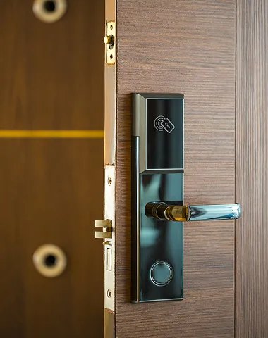 New door lock and handle fitted to a wooden door